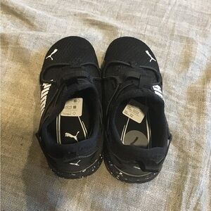 New, never worn, black & white Puma gym shoes, toddler boy . Size 7C